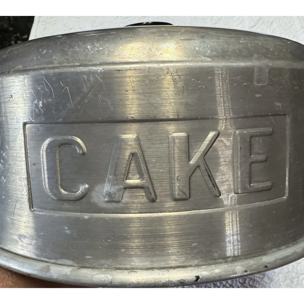vintage 1950s‎ aluminum cake topper that says in embossed letters 